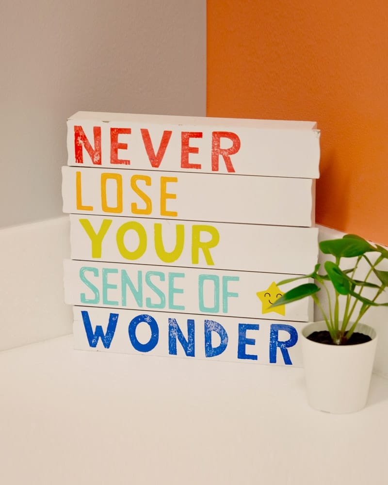 Blocks with words written on them "Never Lose Your Sense of Wonder"